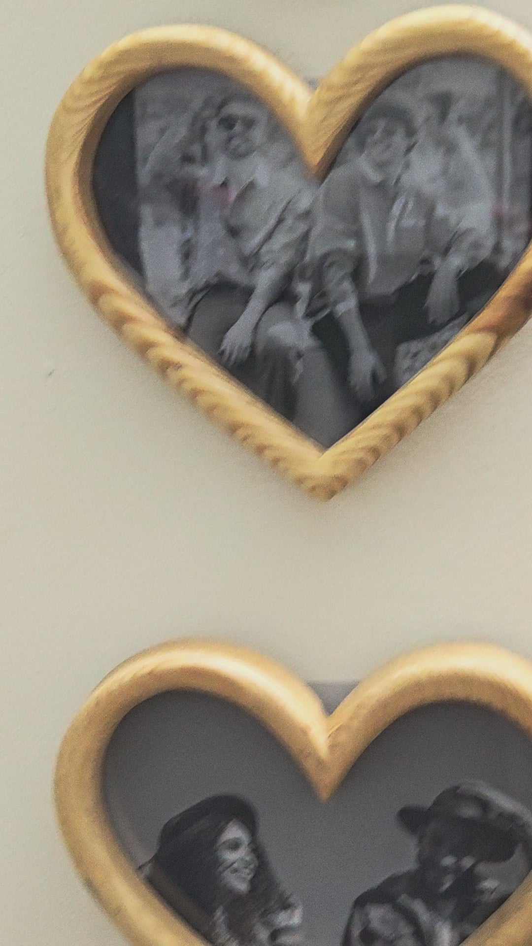 Two heart-shaped wooden photo frames.